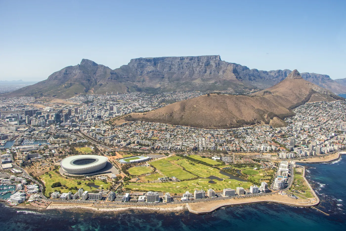 Aerial view of the Cape Town City Bowl with the stadium, the harbour and Table Mountain behind