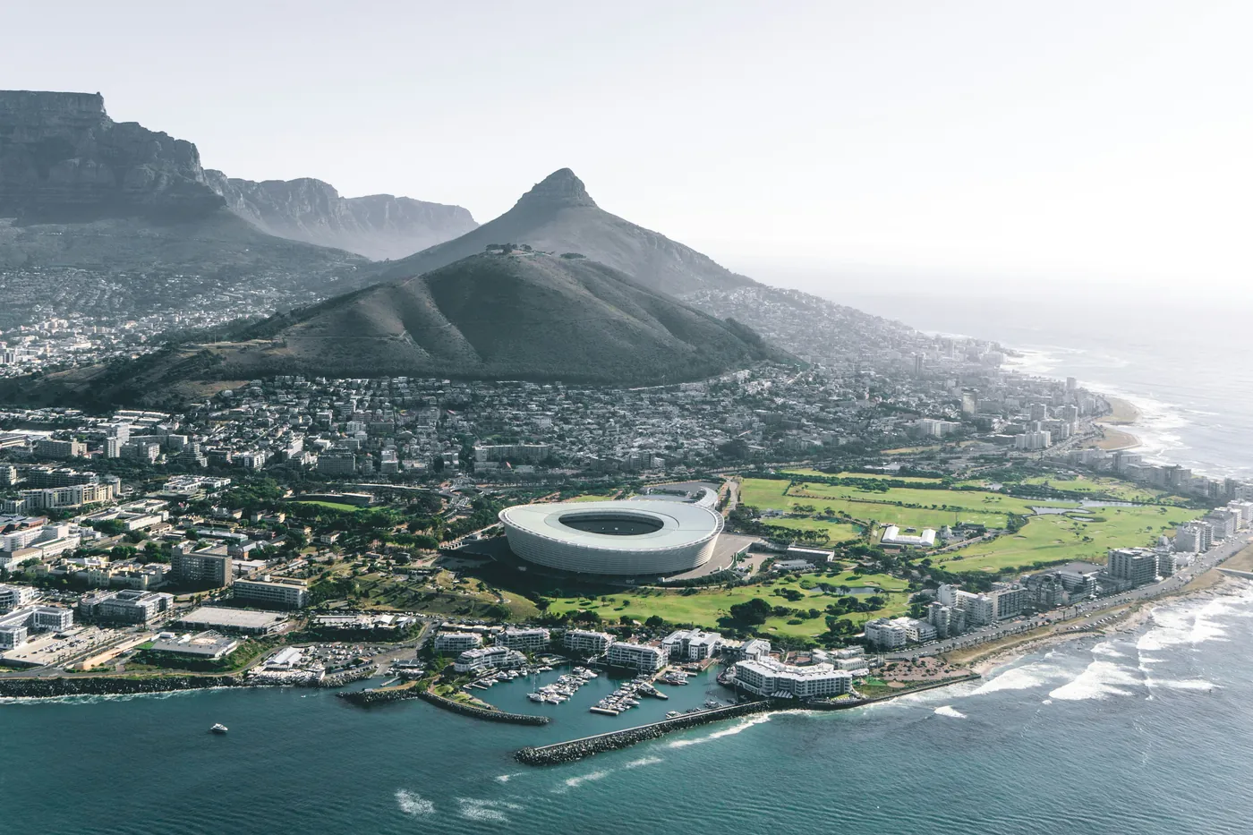 Aerial view along the Atlantic seaboard with Signal Hill, Lion's Head and the stadium below