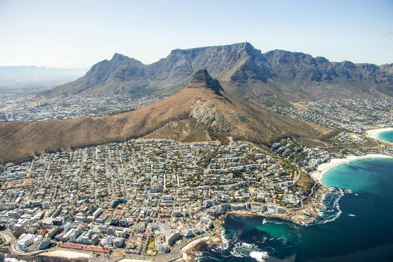 Aerial view of Table Mountain, Lion's Head and the Atlantic coastline at Camps Bay